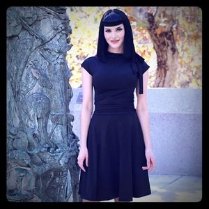 Super cute little black dress.